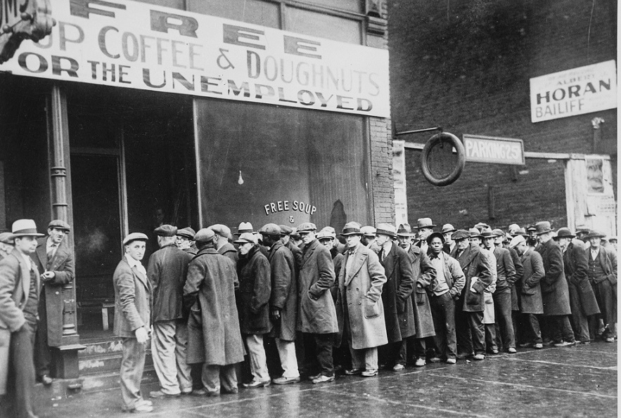 Unemployed_men_queued_outside_a_depression_soup_kitchen_opened_in_Chicago_by_Al_Capone,_02-1931_-_NARA_-_541927